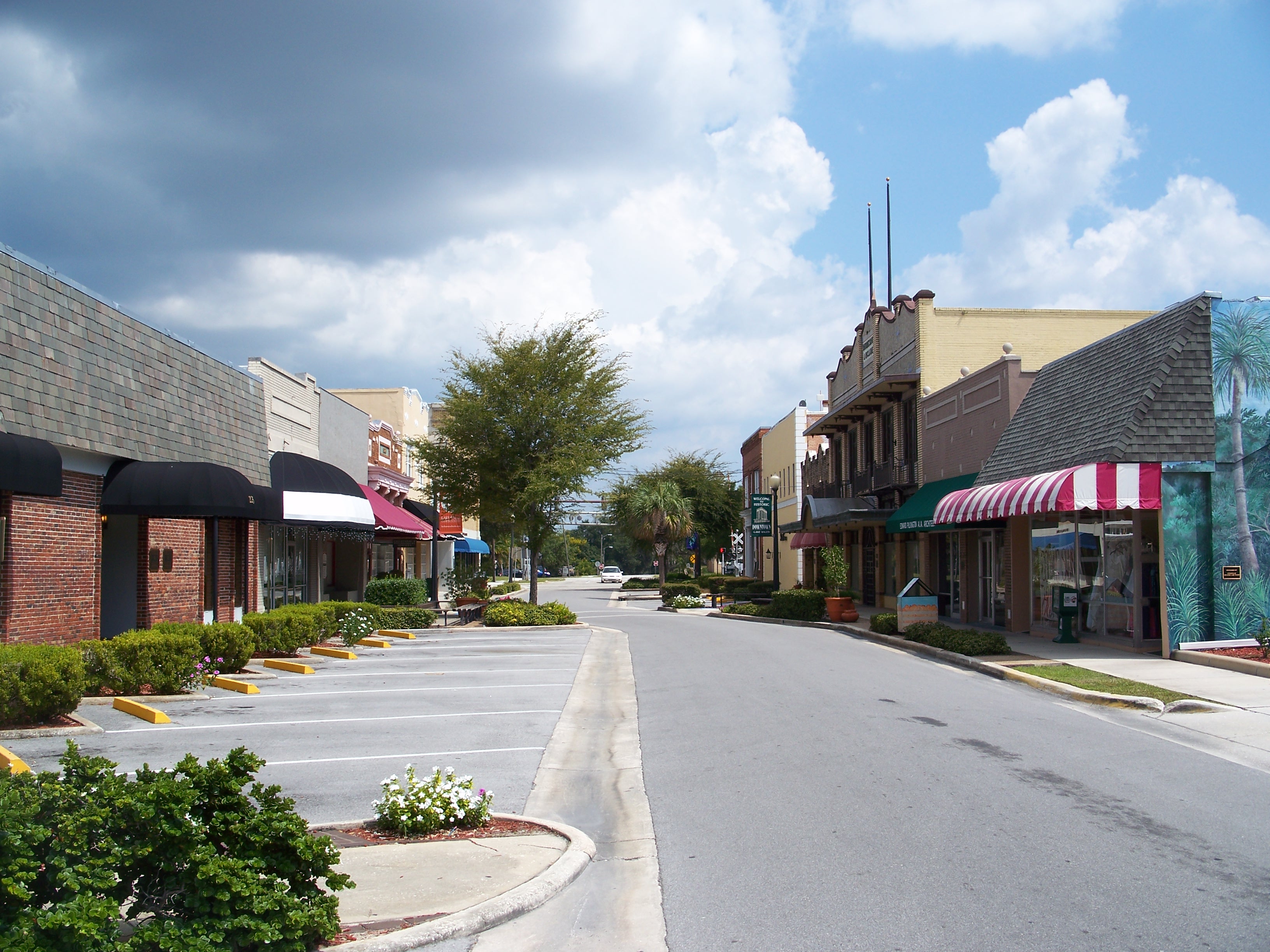 Historic storefronts and tree-lined street in downtown Lake Wales